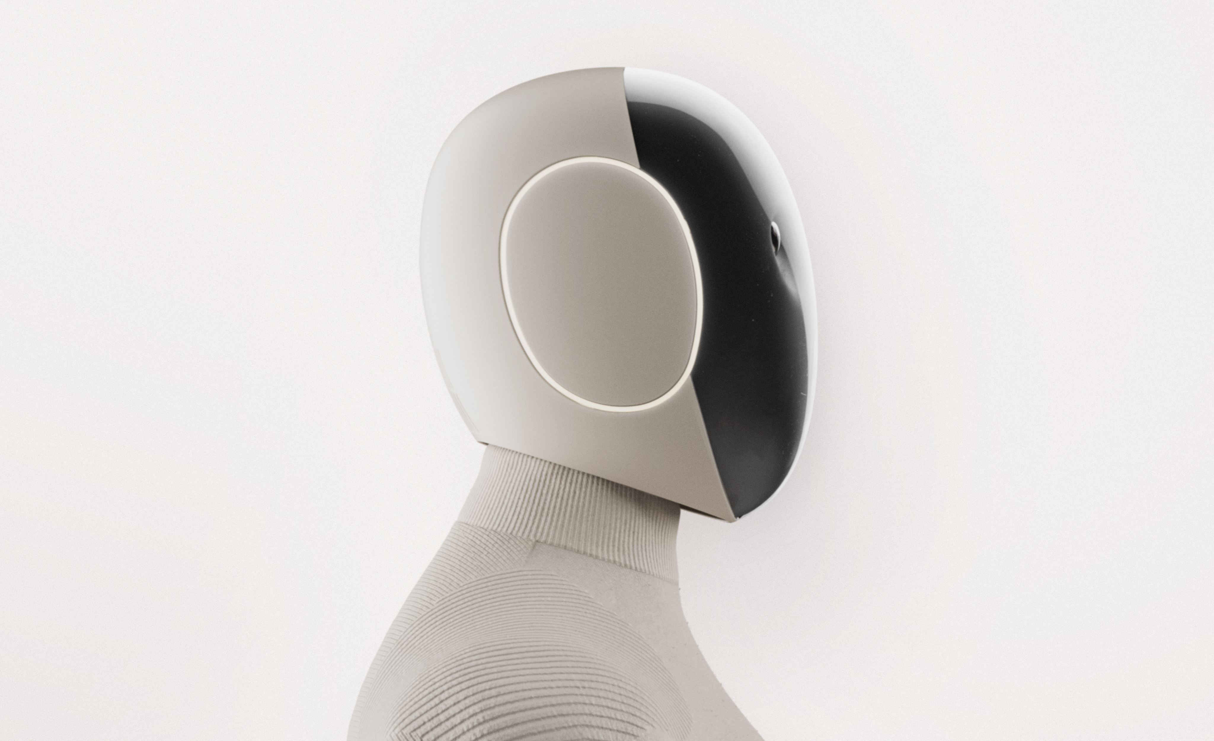 Close view of a humanoid robot head with a white front shell, circular recessed face, and glossy black rear, on a light background.