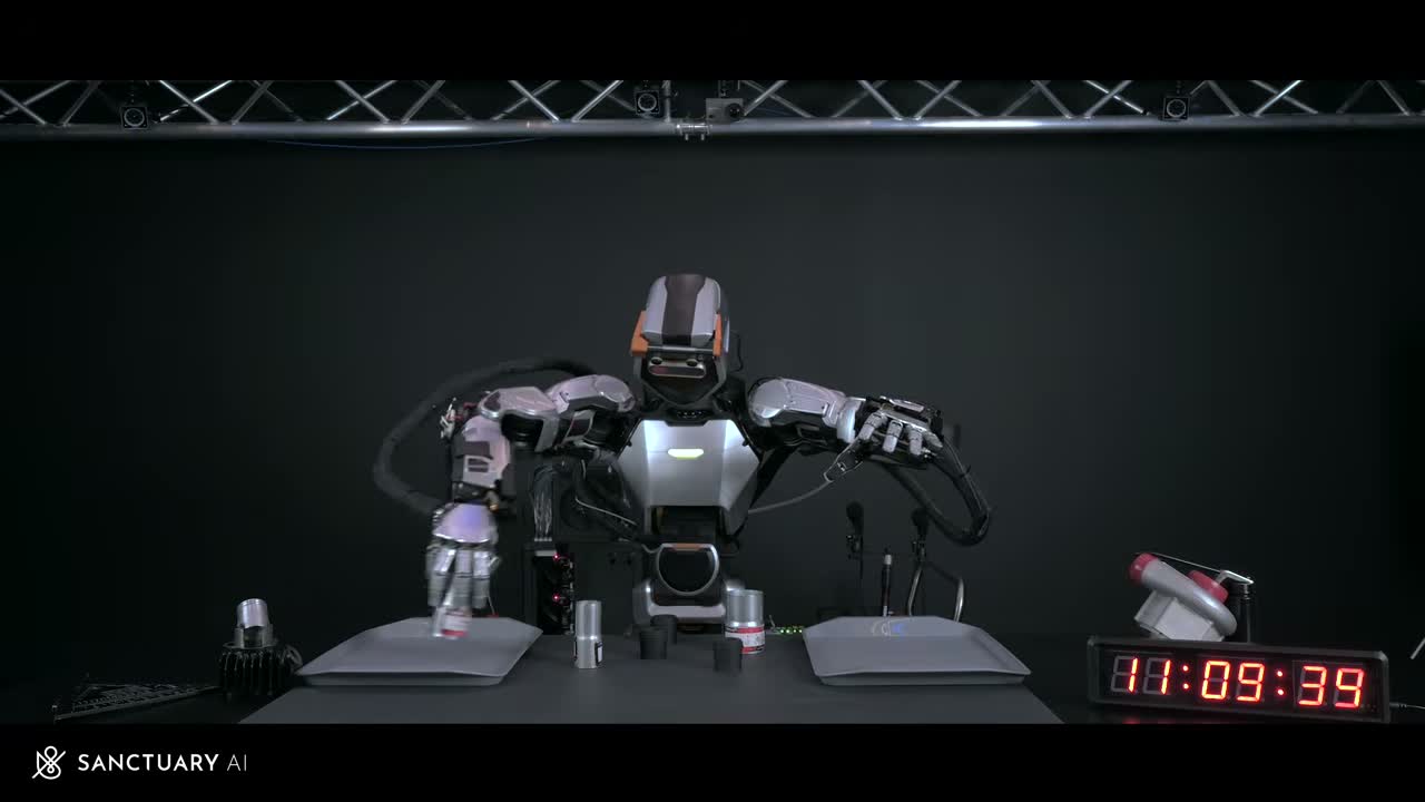 Sanctuary AI Phoenix humanoid robot manipulating objects on a table during a timed demonstration. Still from the official Sanctuary AI video "Phoenix at Human-Equivalent Speed" (2024).